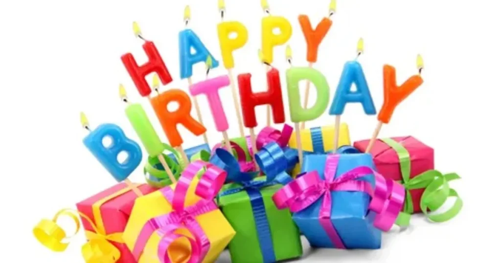 Happy birthday candles with colorful wrapped gifts